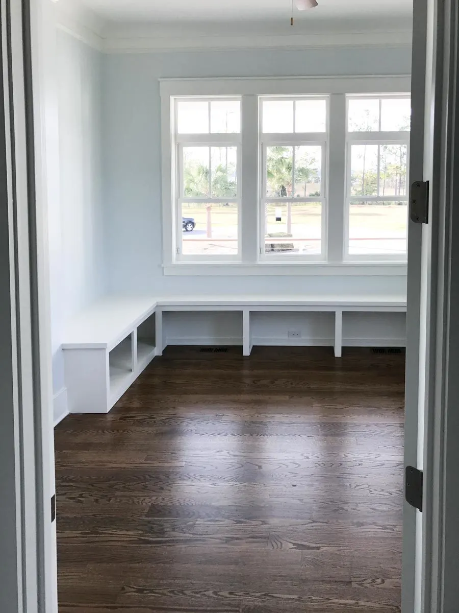A seating nook beside the window in the guest room.