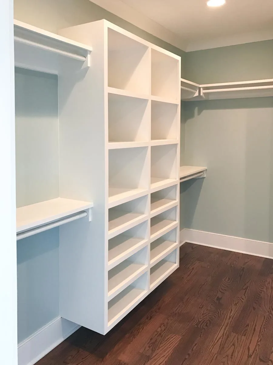 A wall-mounted hanging shelving feature in the closet.