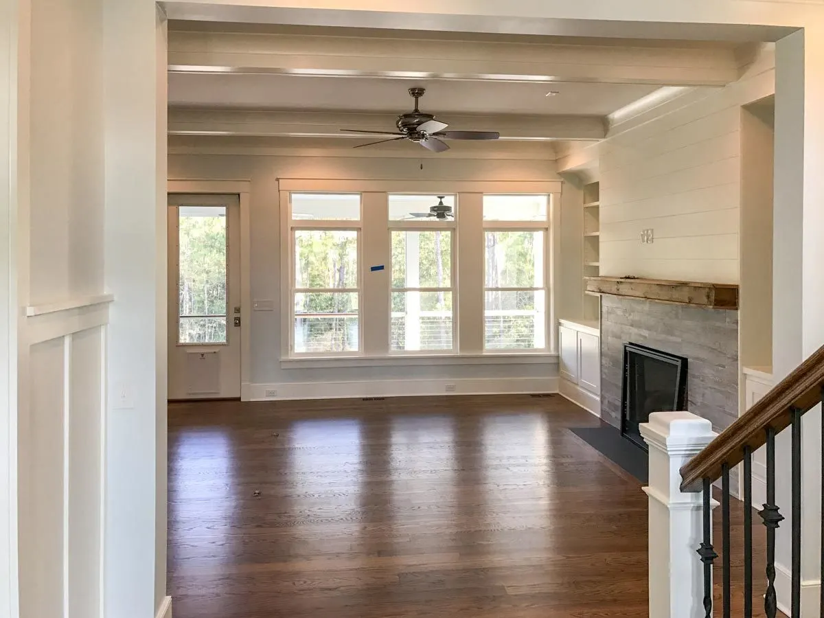 Excellent interior design with wood accents and large windows.