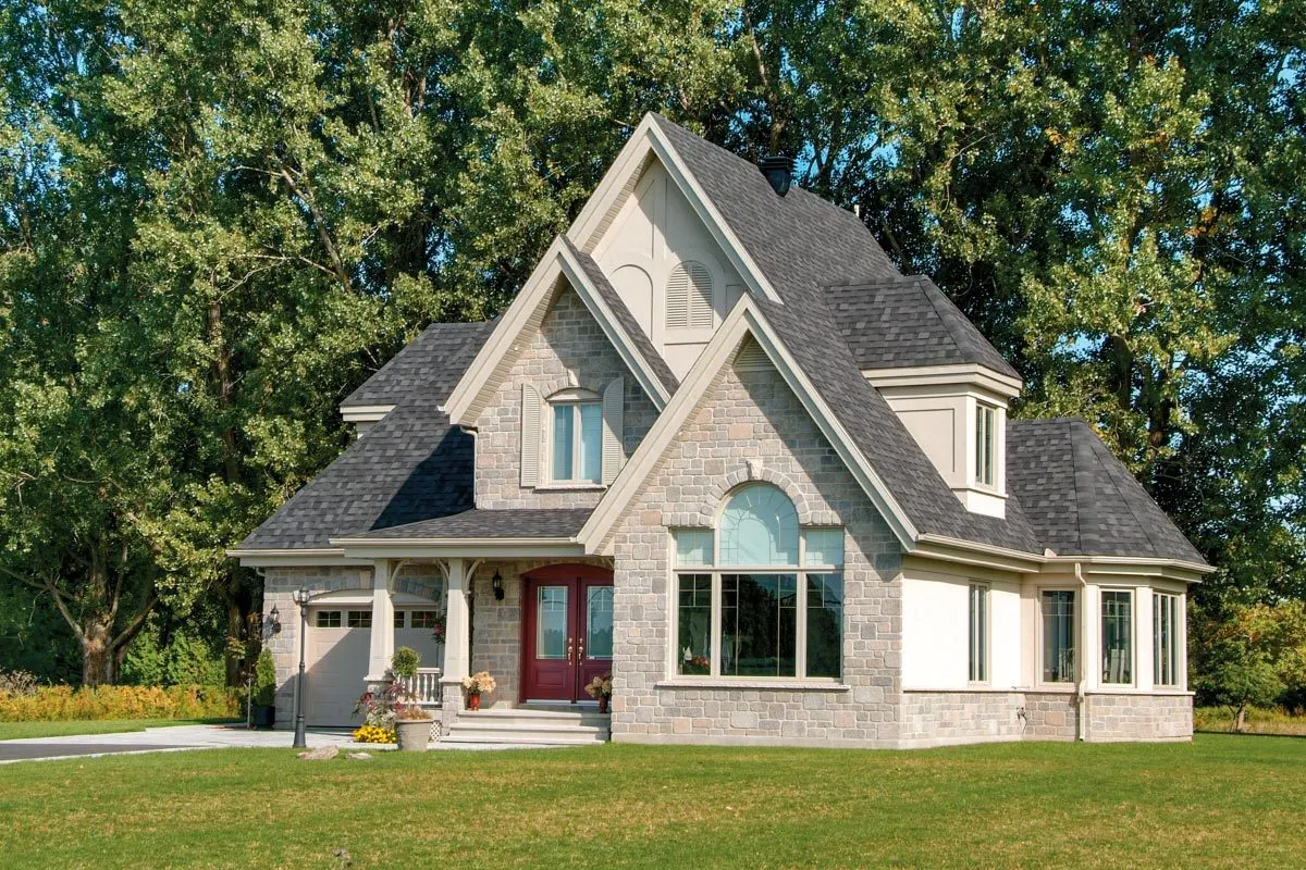 The house exterior features a beautiful window façade with a double door style main entry.