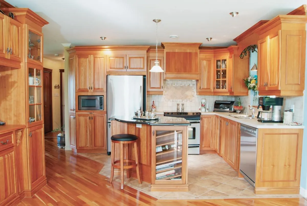 The interior design of the house's kitchen features a magnificent wood accent.