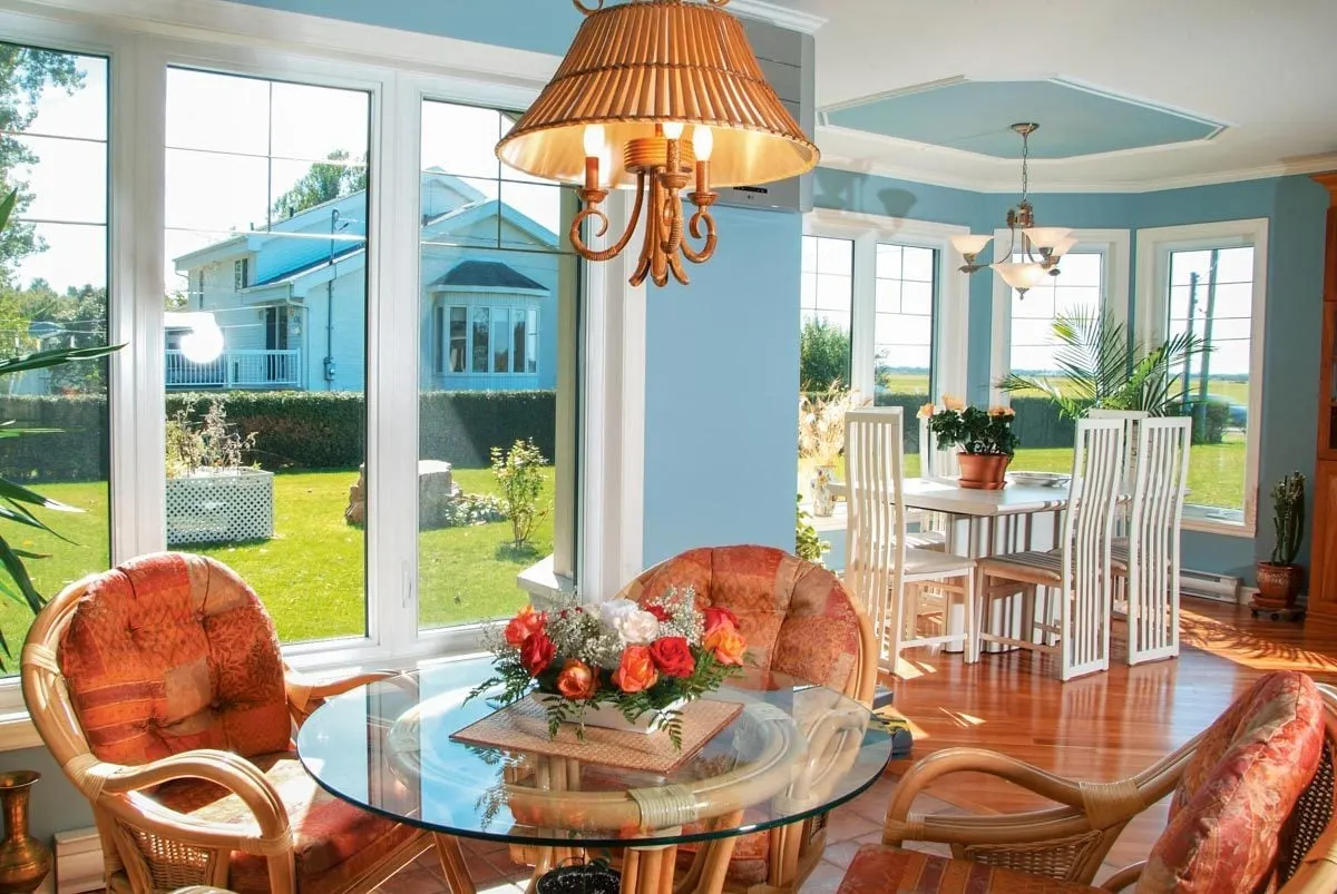 Elegant seats and tables with ornate chandeliers adorn the dining area.
