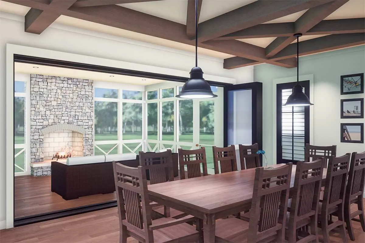 Ten-seater solid wood dining table with exposed beam ceiling.