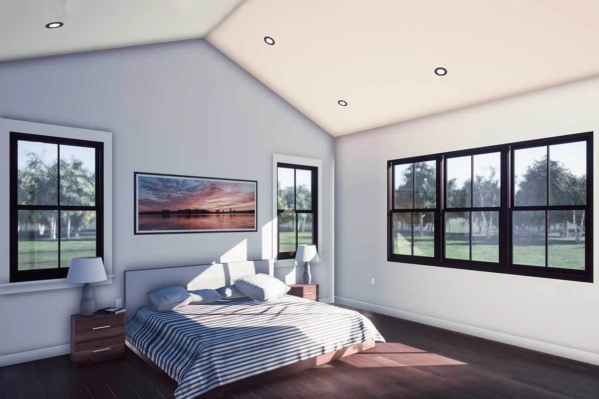 The bedroom is a cozy design with black window frames.