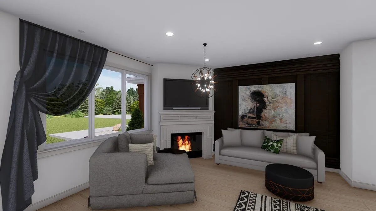 Two lovely couches and a fireplace with a round chandelier.