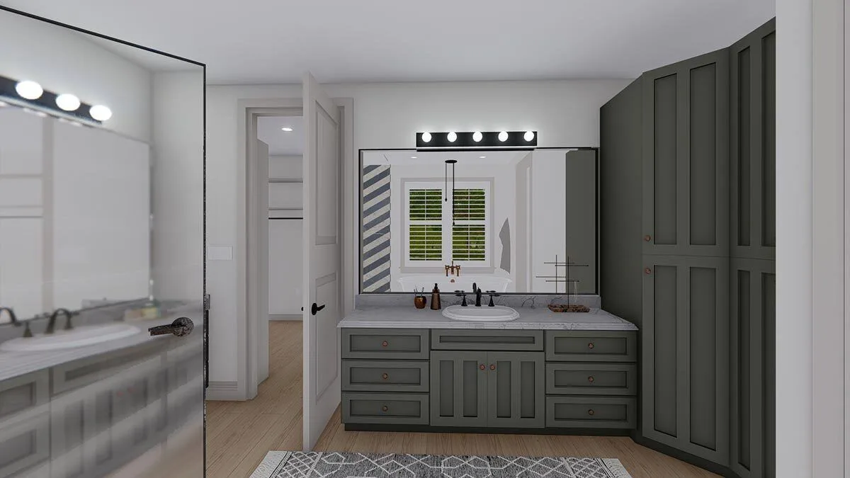 A vanity area with a large mirror enhances the space's aesthetic.