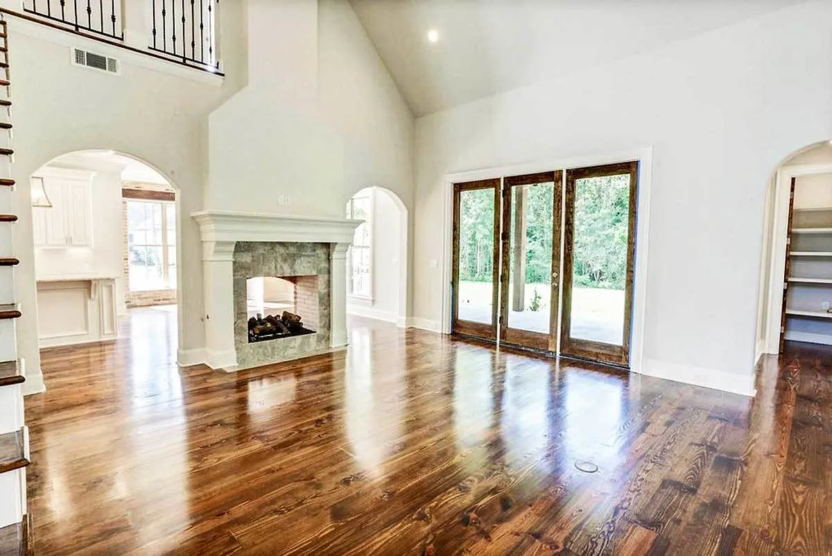 Wooden door frames and classy flooring complement the living space.