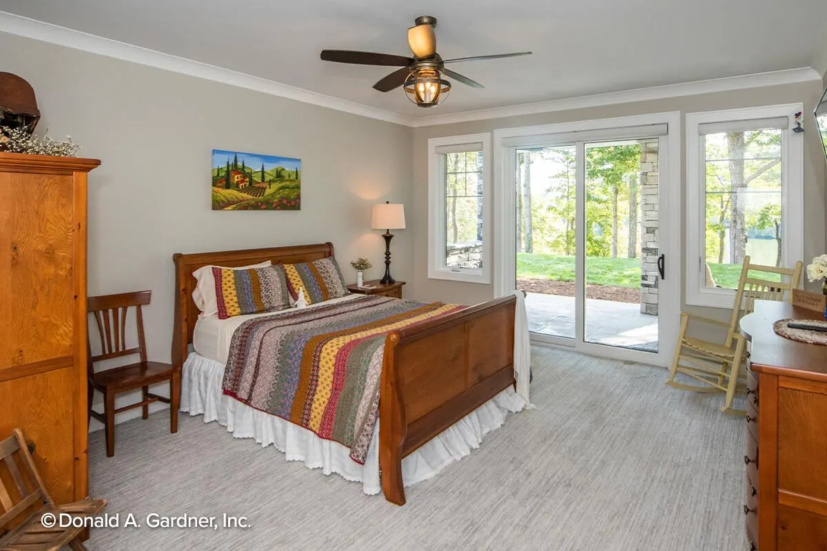 Wooden accent furniture complements the bedroom's white interior color perfectly.