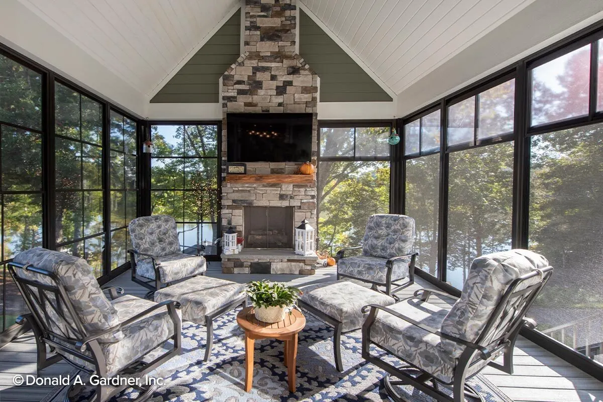 The screened porch in the back has a high ceiling and a fireplace.