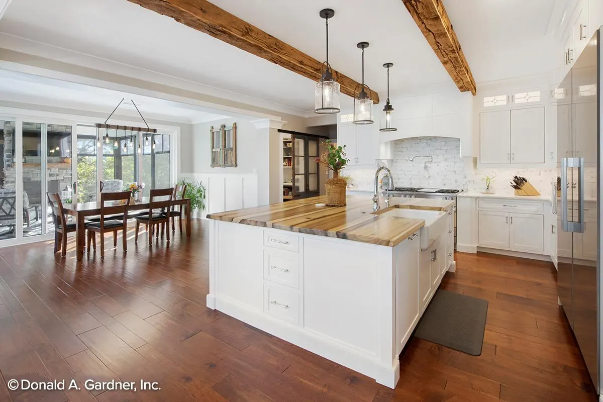 A modern kitchen island with a wood counter design.