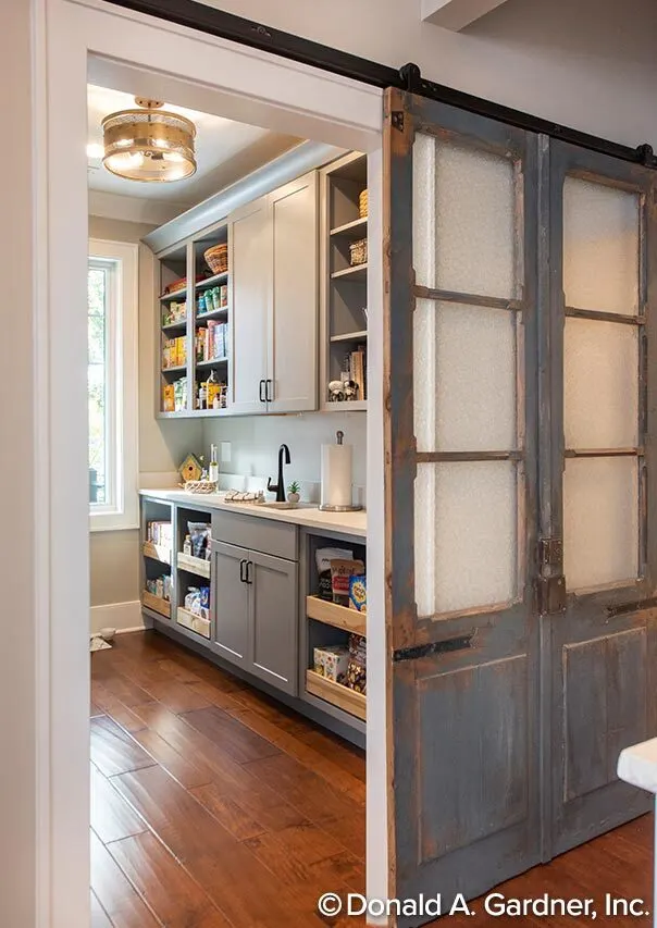 Pantry with handy wall-mounted cabinets and racks.