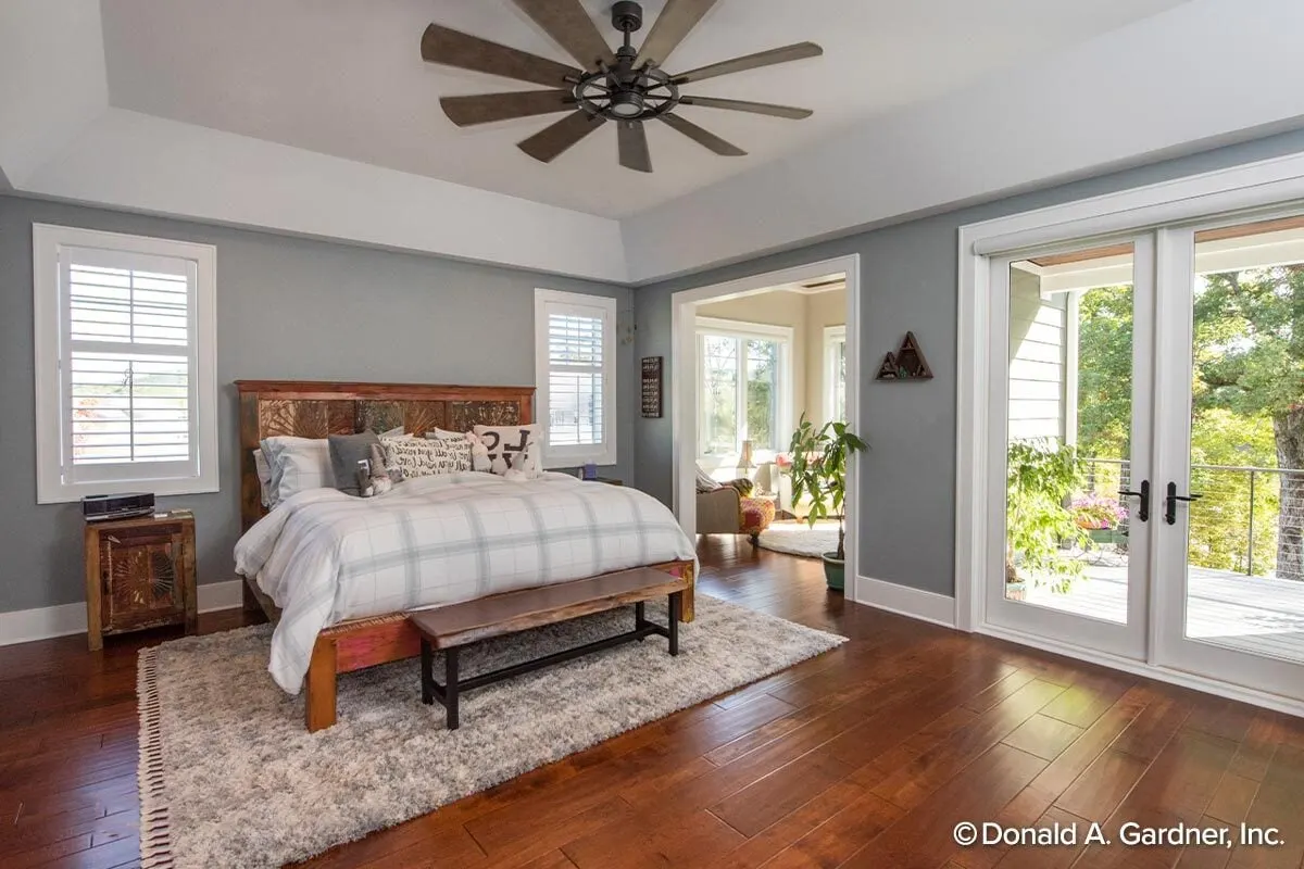 Master bedroom with access to the porch area in a craft-style design interior.