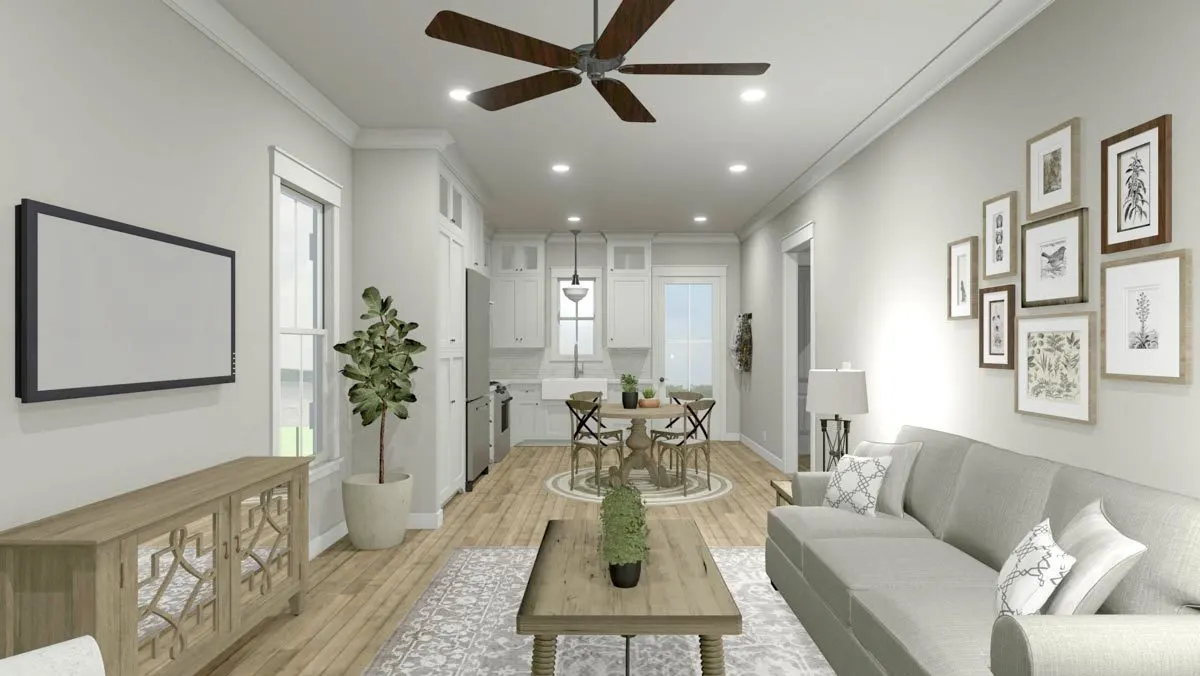 Indoor plants adds life to the living room area with a wooden flooring accent.