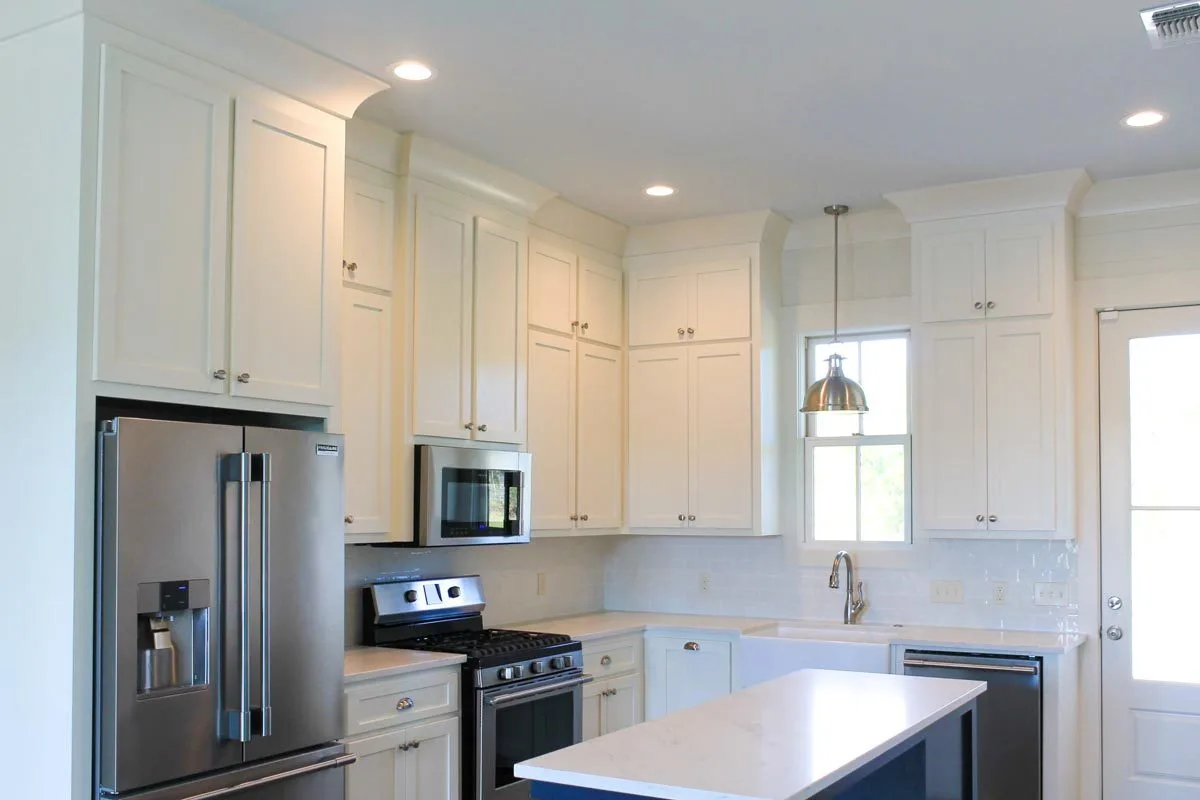 The interior has cabinets and a contemporary appliance.