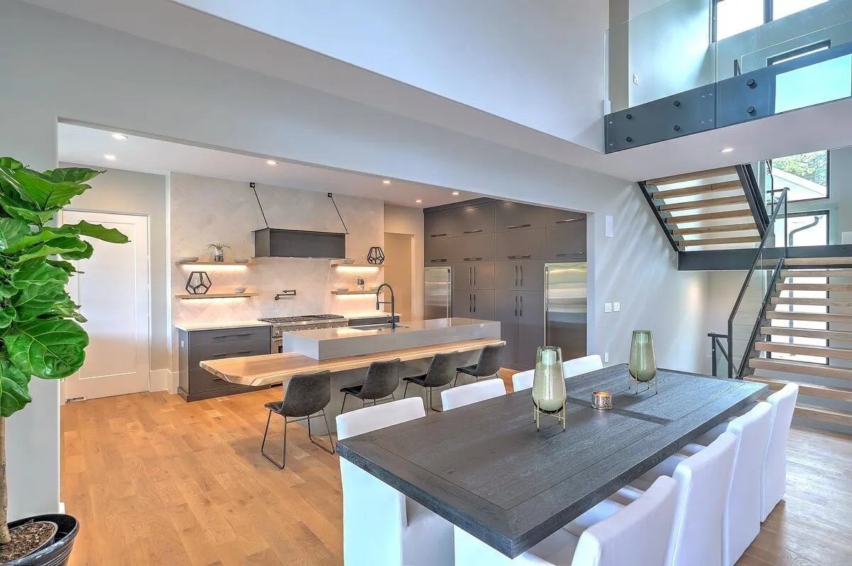 Modern kitchen interior design with gray and wood accents.