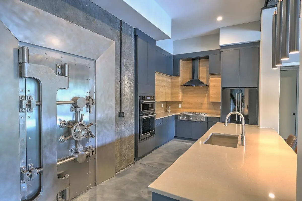 Cooking room equipped with modern appliances such as a stove, range hood, and oven.