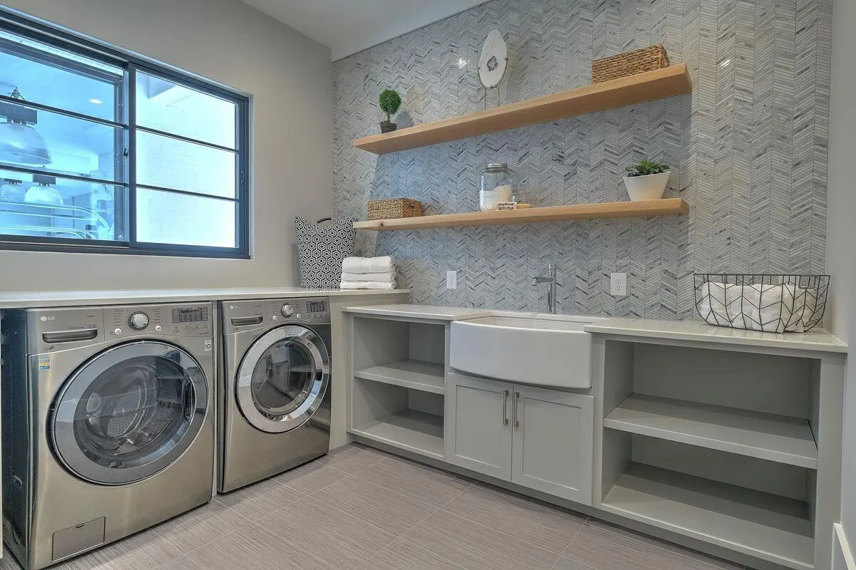 Laundry room with a spacious gray interior design accessories.