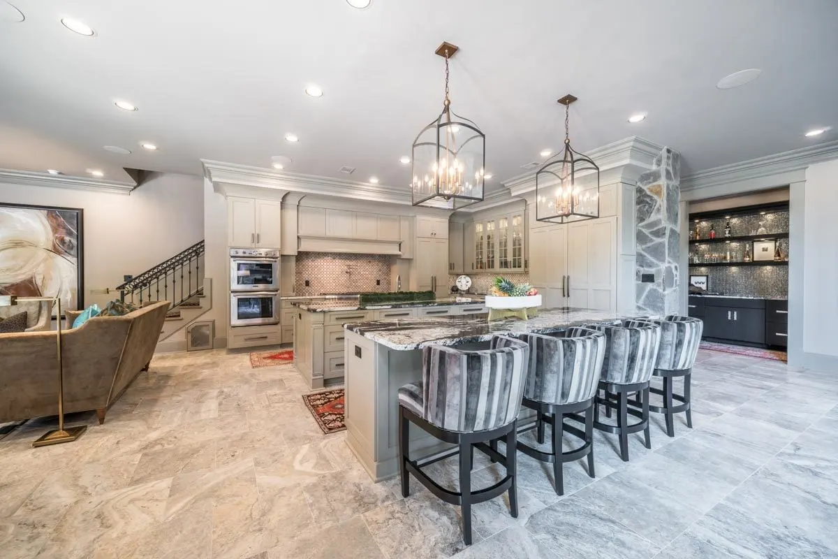 Beautiful white and gray design chairs match the bar area table.