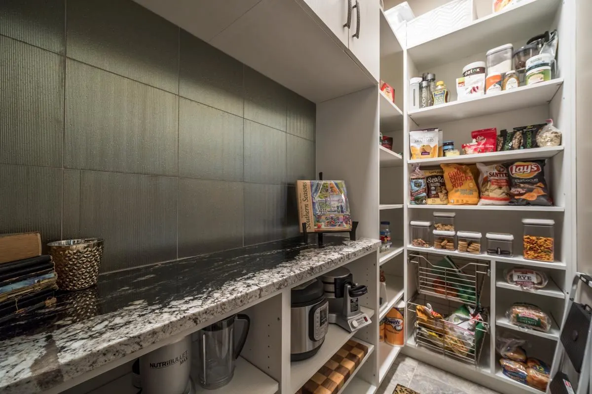 Pantry area with excellent racks and drawers.