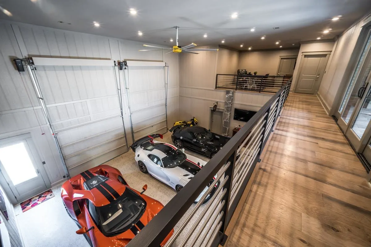 Three-car garage space with door access to the storage/safe room.