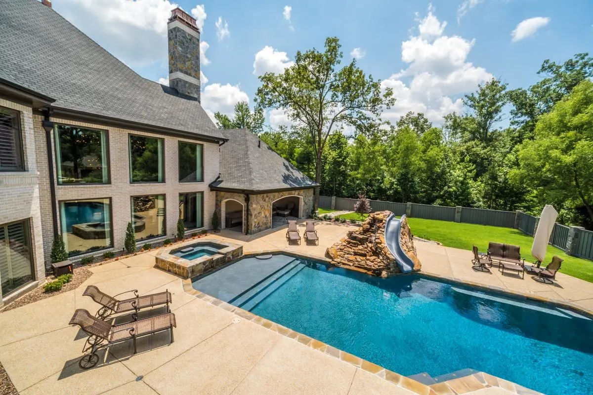 The house has a stunning exterior with brick and stone walls.