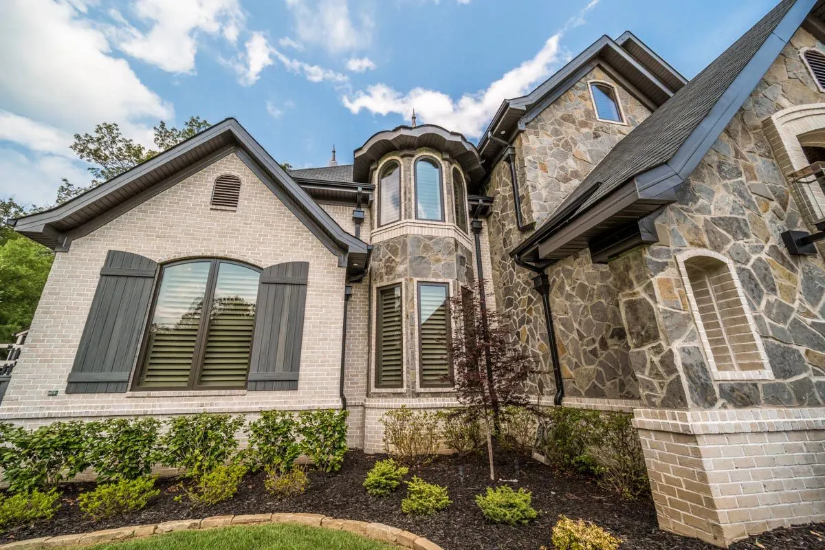 A home in the French style design, from the windows to the roof.