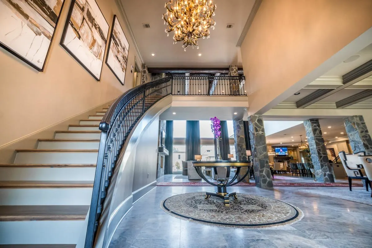 A magnificent chandelier hangs over the grand entrance.