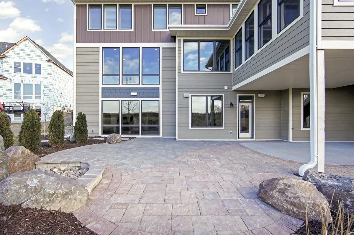 An open patio with landscape design in the surrounding area.