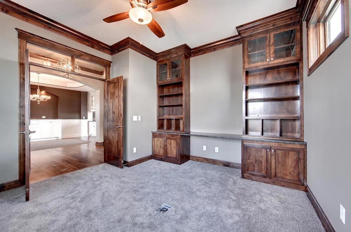 The study area has gray carpet and gray wall paint.