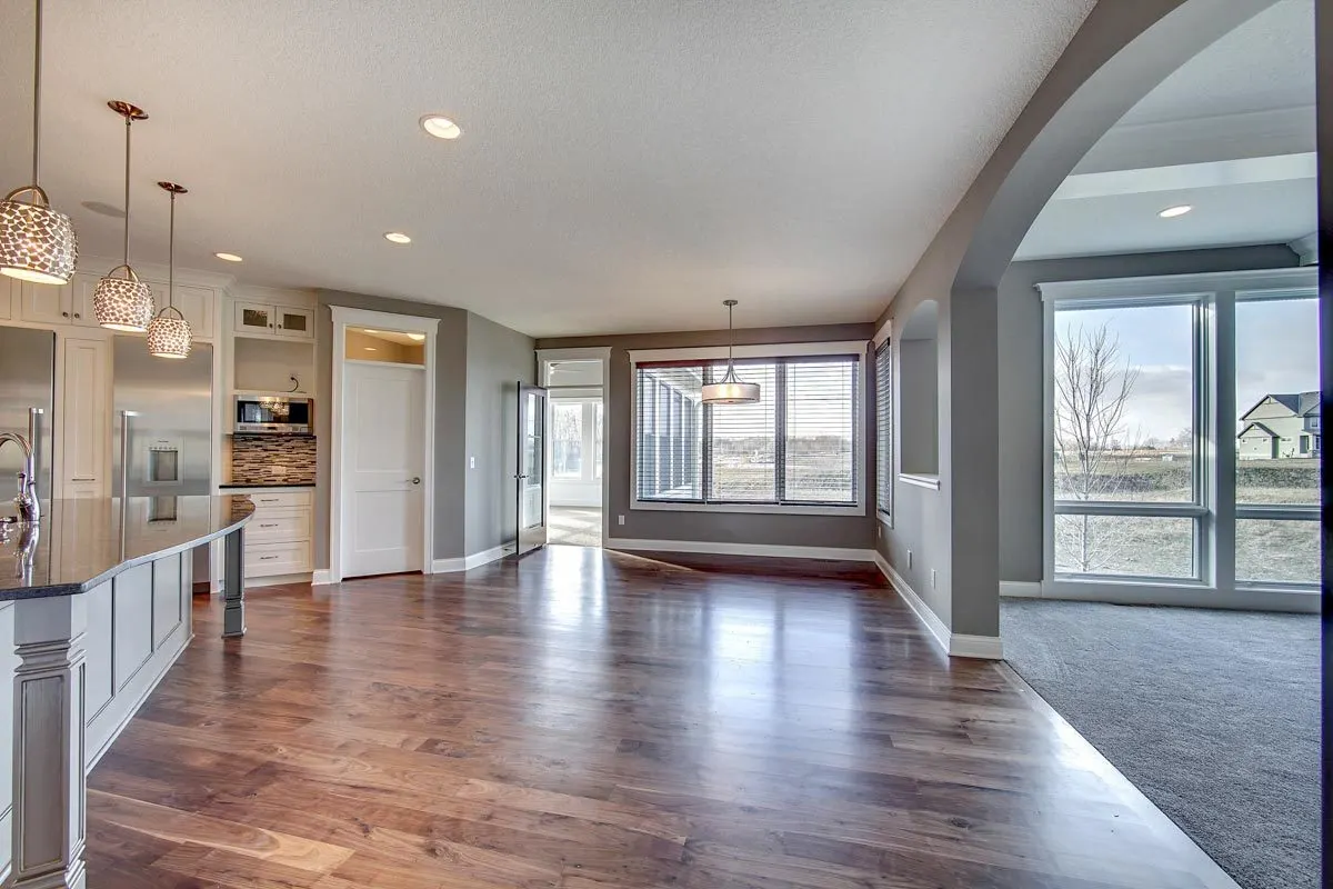 A large dining and kitchen area with access to the porch area.
