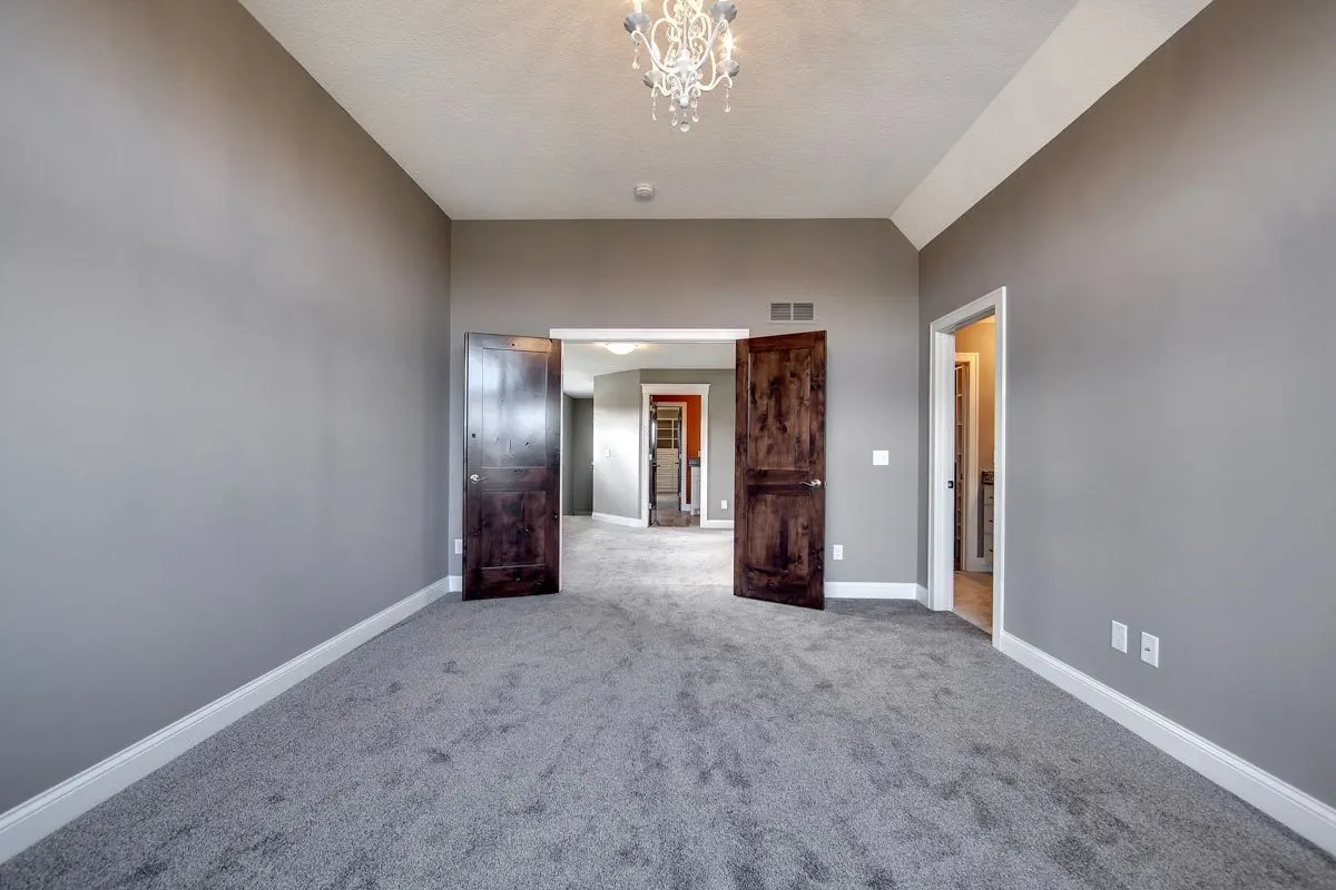An elegant chandelier brings vitality to the room.