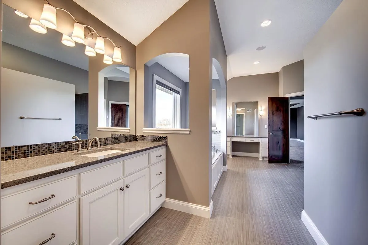 Vanity with wall-mounted light fixtures.