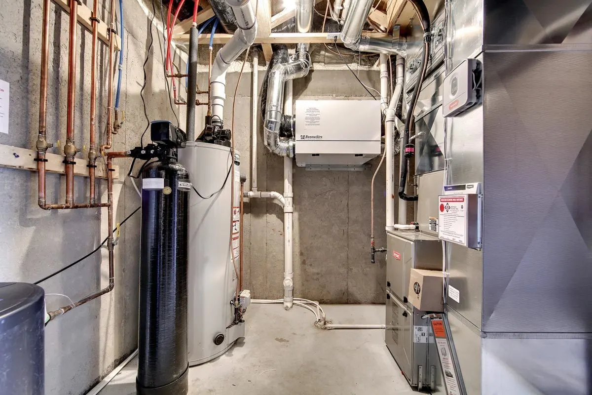 Mechanical area with pipes and equipment.