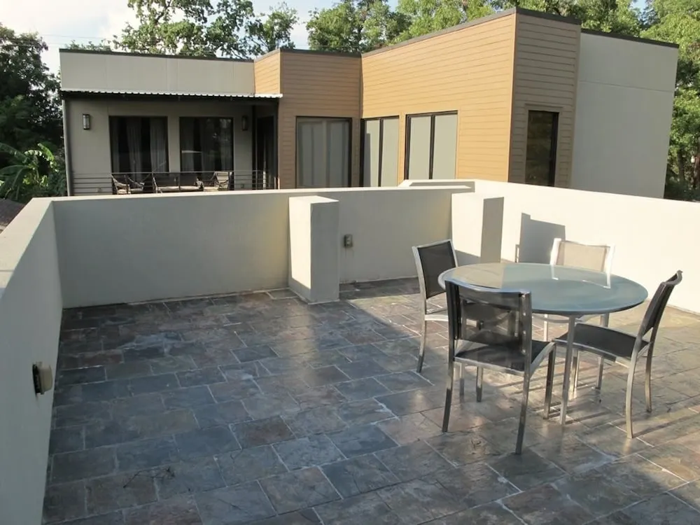 The house's overlook area has stone tile flooring.