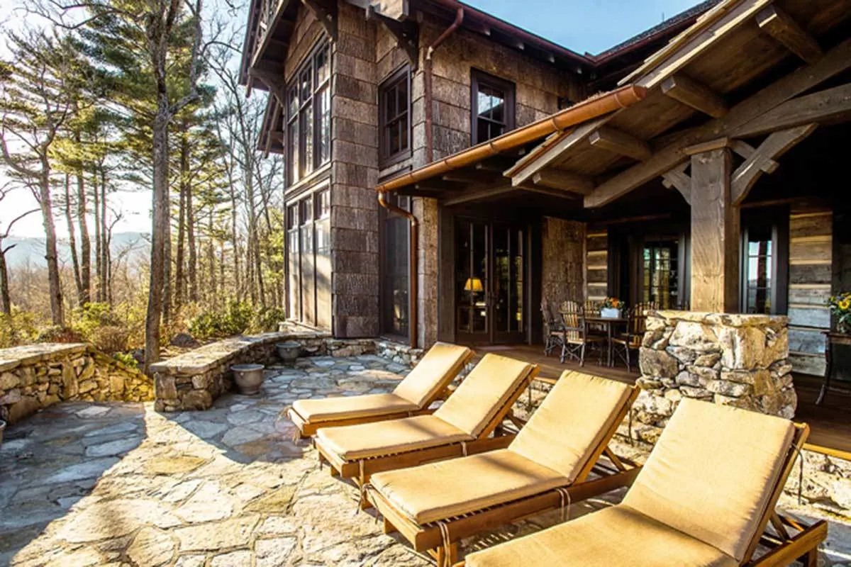 The mountain house's deck and back porch with lounge chairs for great outside views.