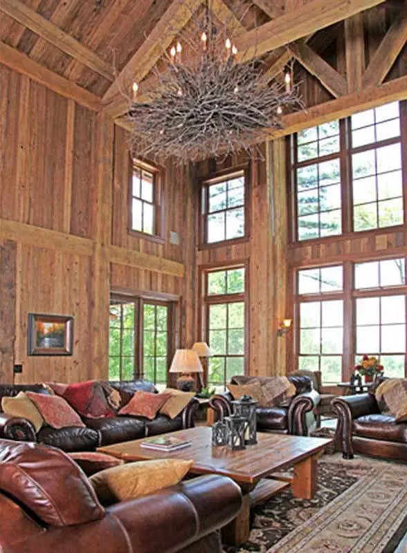 The tree root chandelier dramatically transforms the living space.