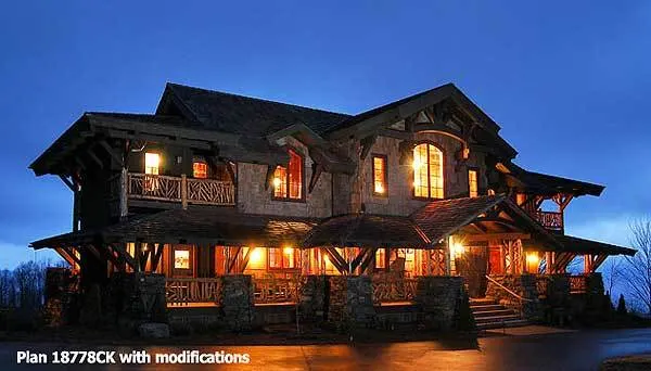 The mountain house's interior lights provide a stunning view at night time.