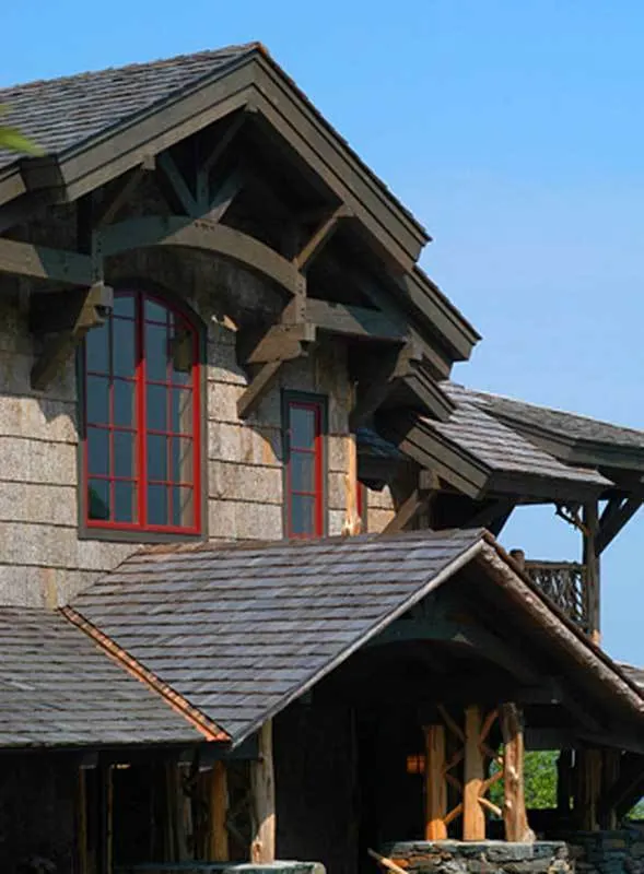 The red window frame has a significant aesthetic influence on the house.