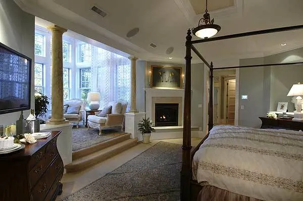 Master bedroom with a large sitting area and fireplace.