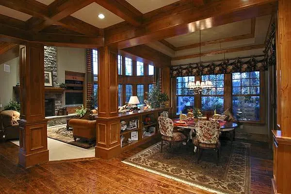 Nook is adjacent to the family room with an elegant round table with a chandelier.