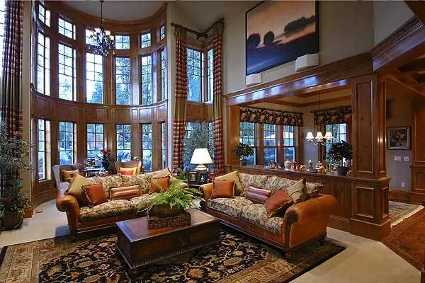 The great room space is decorated with polished wood and a brown color tone.