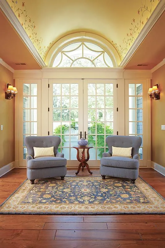 A beautiful solo couch and beside coffee table with a traditional style two way door.