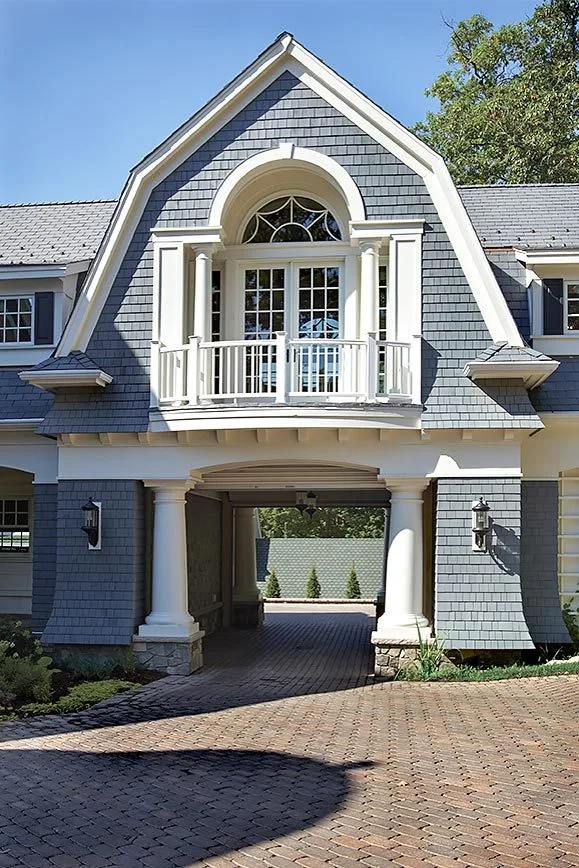 The balcony in the second floor and the car garage under it.