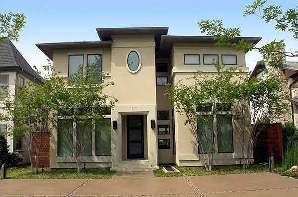 Image of the home's front with the windows and doors vertically framed.