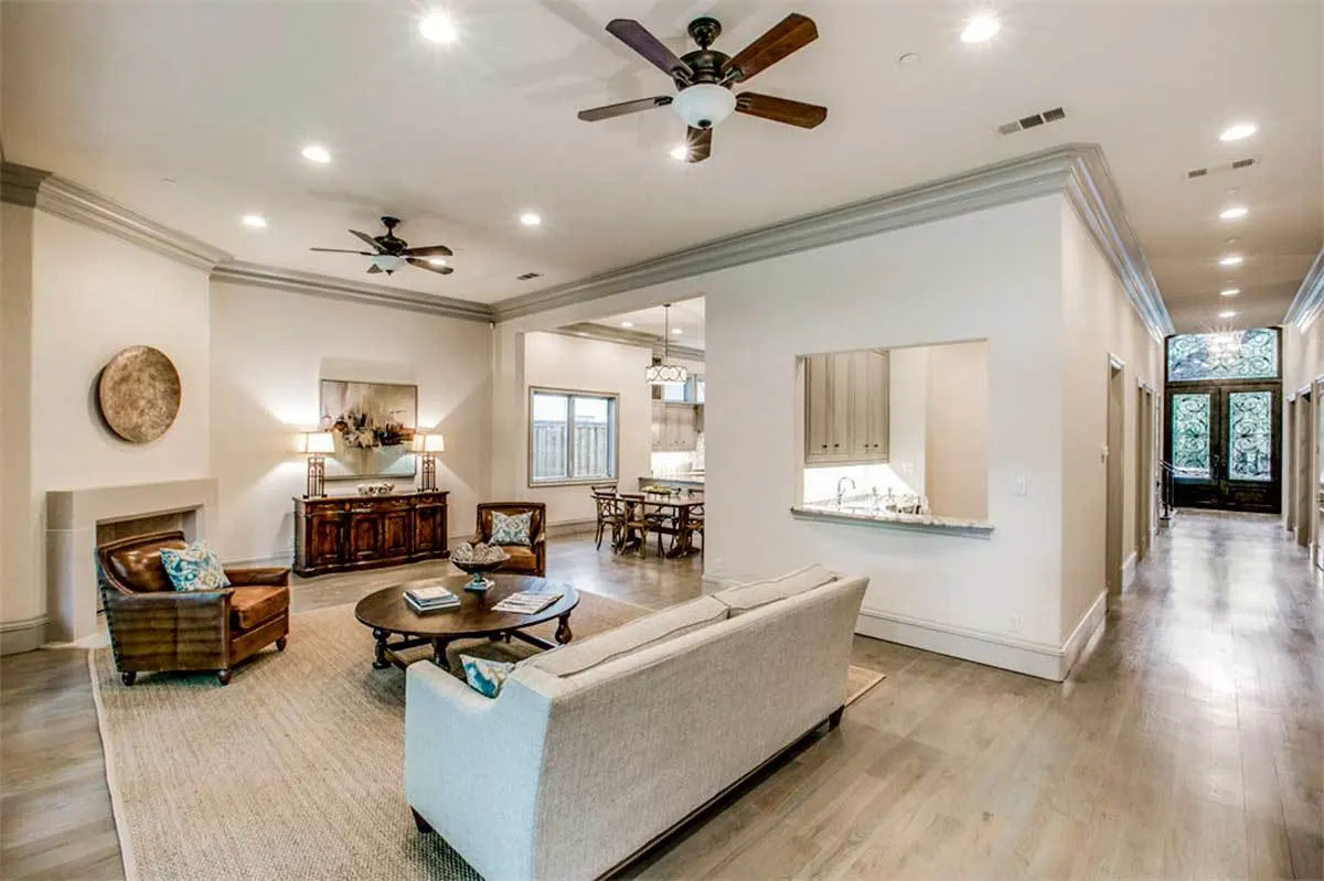The family room is in a modern style design with vintage furnishings and a fireplace.