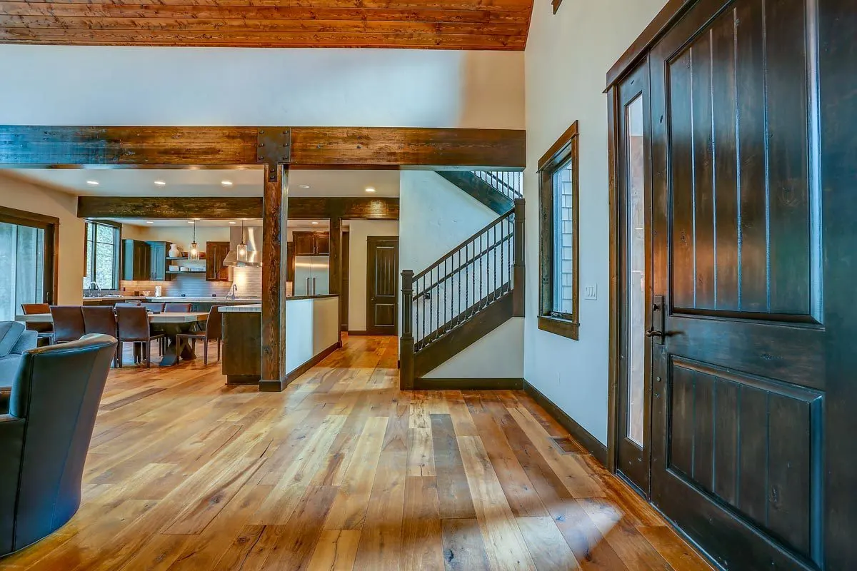 The stairway to the second floor are on the right side of the home's door entry.