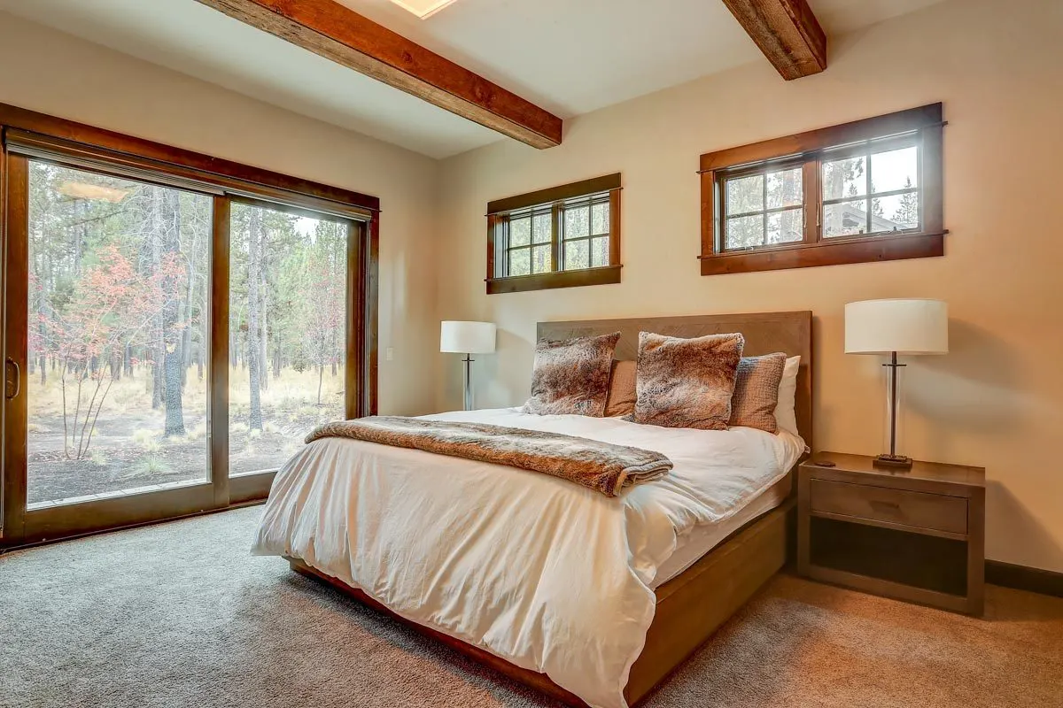 Bedroom in a serene atmosphere with a wood accent bedframe.