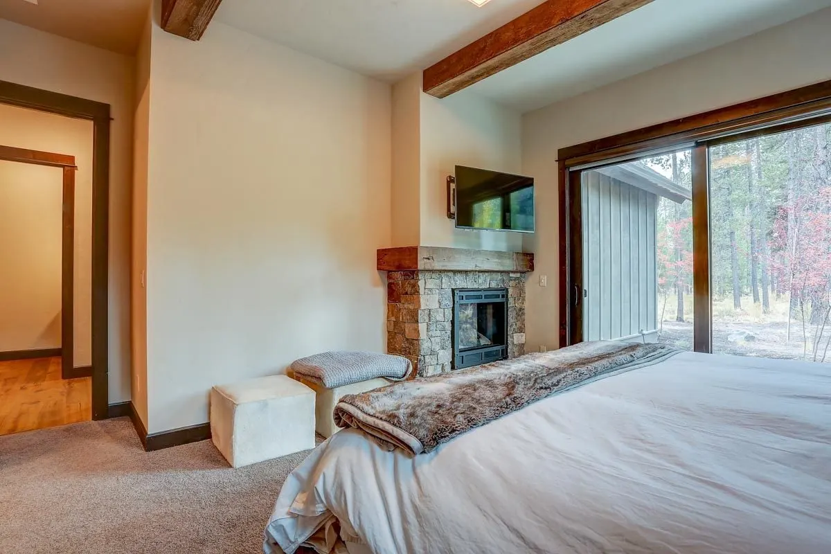 A fireplace with a television over it is also available in the bedroom area.