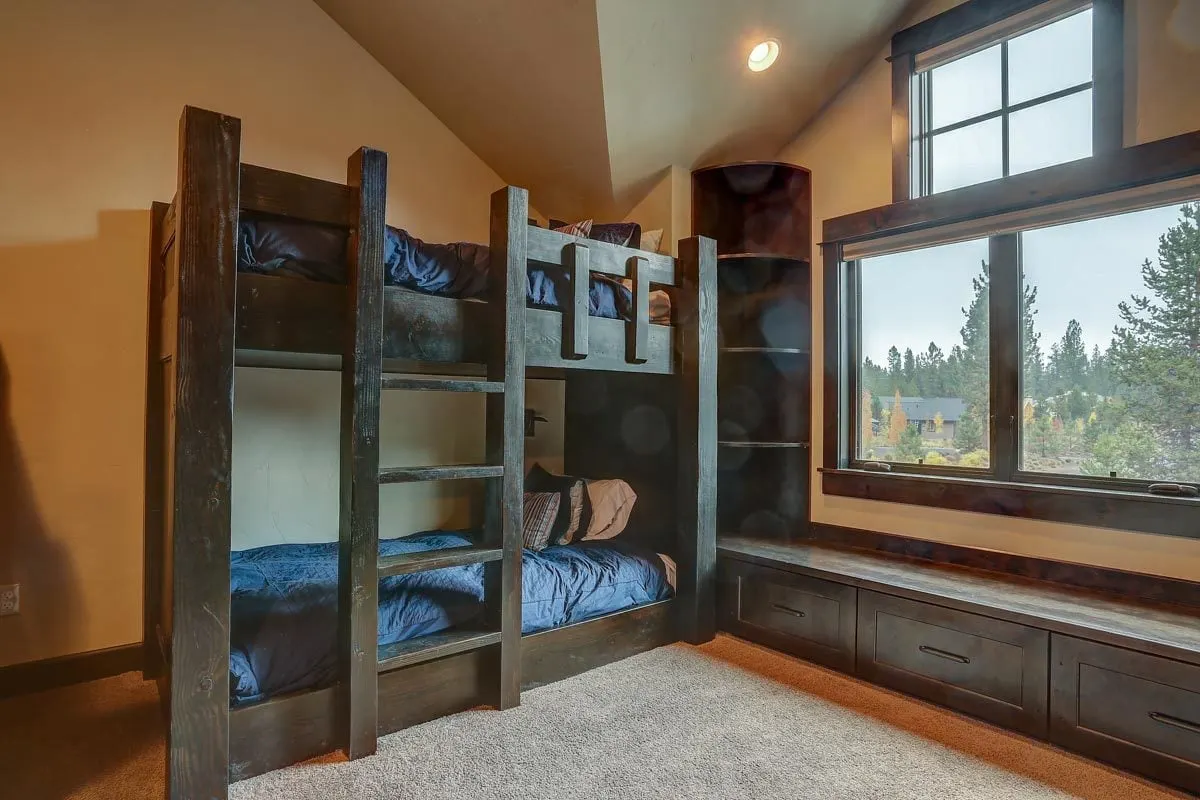 Bunk bed in thick wood frames with reading nook available.