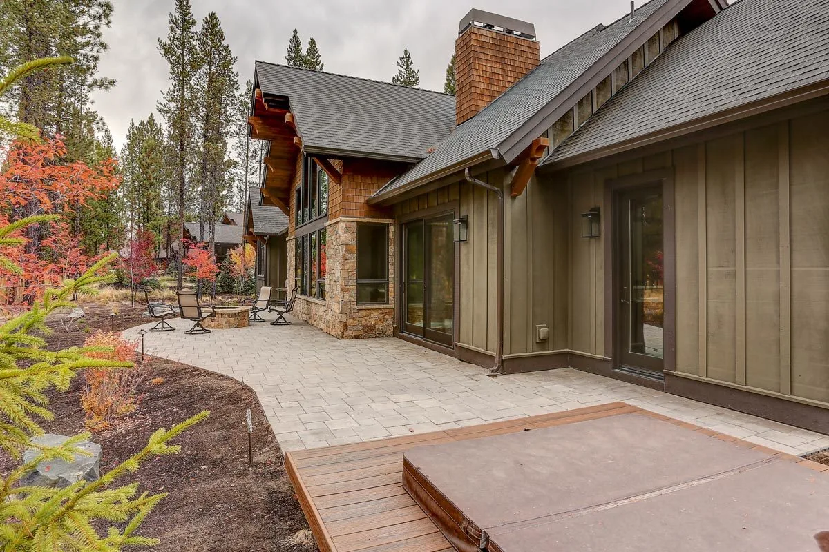 A spa area with a brown wood foundation is accessible near the rear terrace space.
